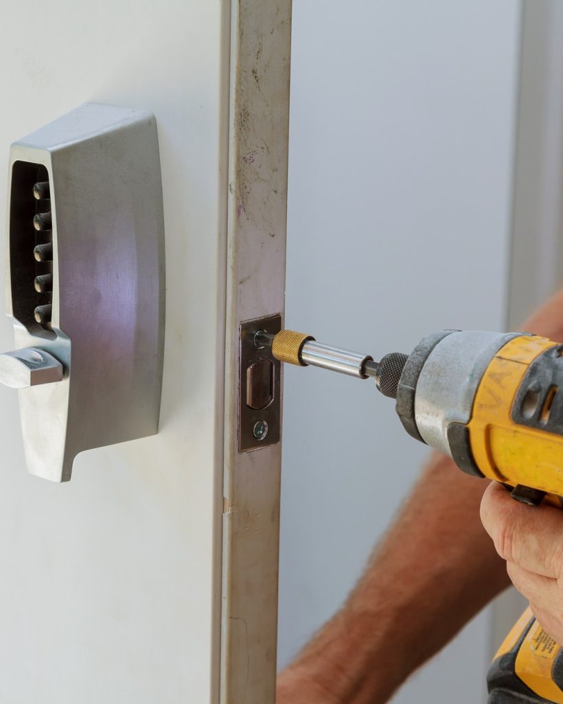 man-installing-of-the-door-with-lock-key-security man-installing-of-the-door-with-lock-key-security